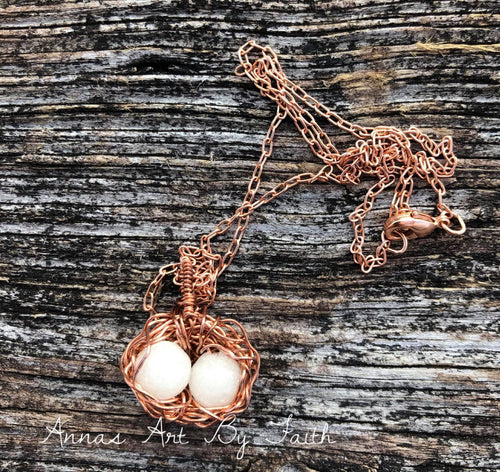 Birds nest keepsake pendant